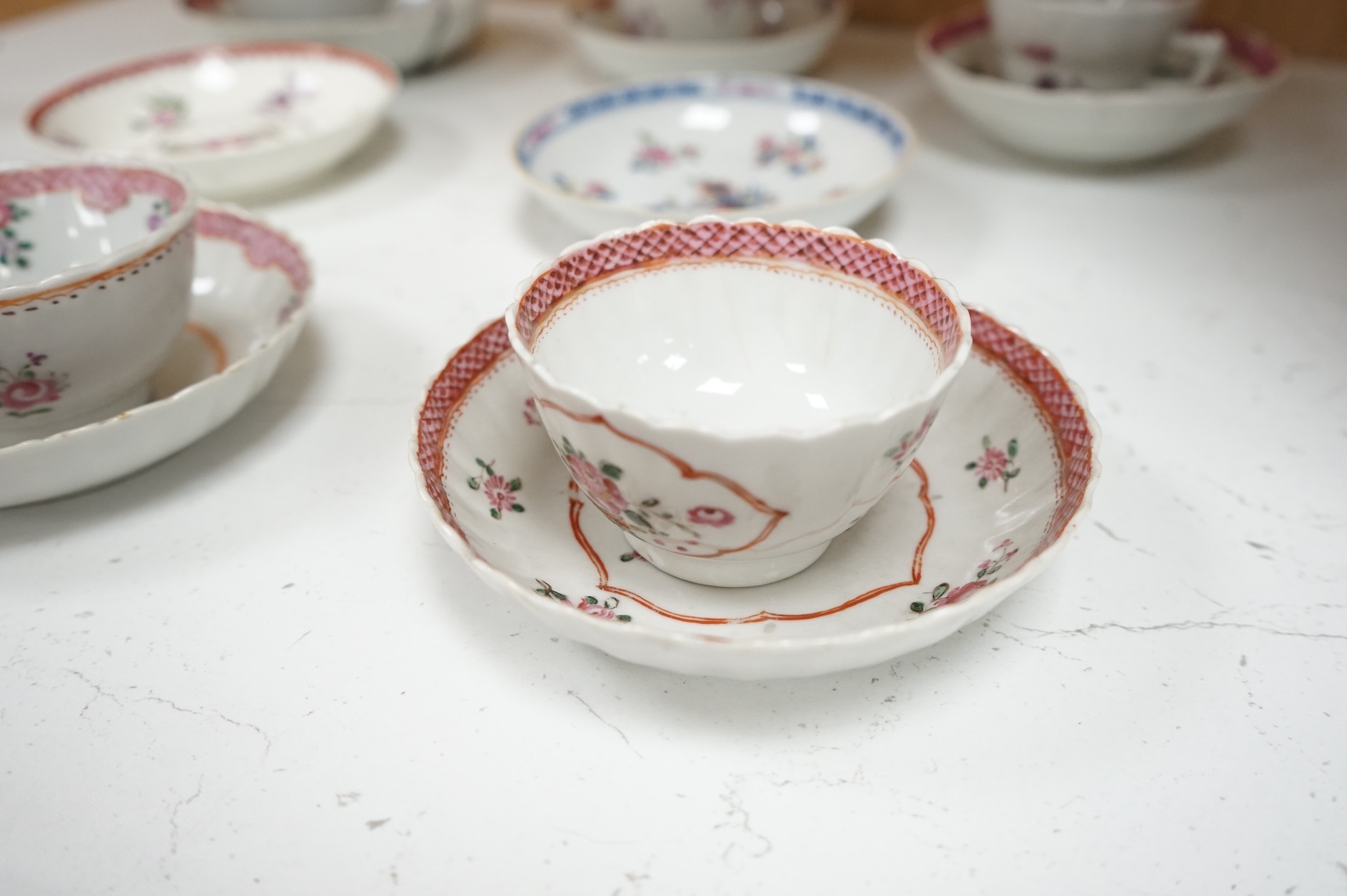 A collection of 18th century Chinese export and English porcelain to include tea bowls and saucers, largest saucer 14cm in diameter
